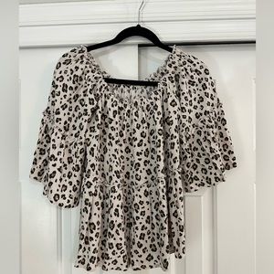Off the shoulder. Cheetah print top with bell sleeve